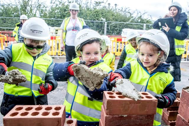 Pupils Lay Bricks at Romeo Place