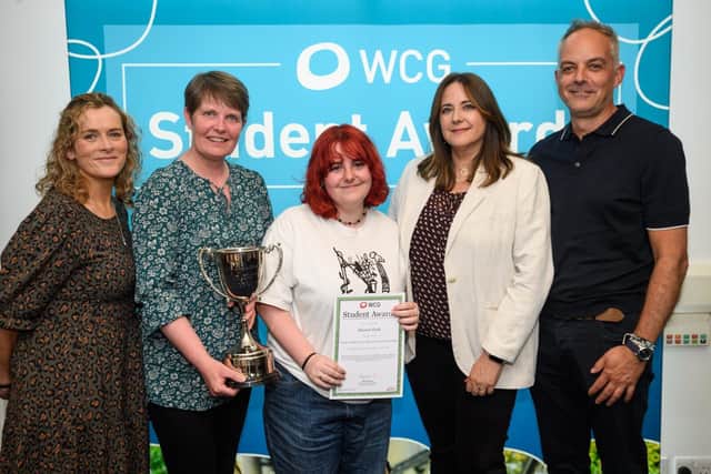 Eleanor Flude (centre) is presented with the award