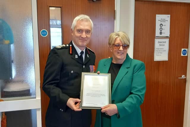 Monica Lemon was presented with a Certificate of Commendation by Warwickshire Fire and Rescue’s Chief Fire Officer, Ben Brook, at a ceremony last month. Photo supplied by Warwickshire County Council