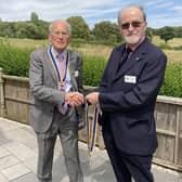 Michael Heath (at right) hands over his Rotary Club of Royal Leamington Spa presidency to David Leigh-Hunt. Picture submitted.