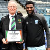 Justin Marsden and Liam Francis collected the Team of the Month award for January from UCL chairman Alan Poulain ahead of Rugby Town's home game last weekend. Pictures by Martin Pulley