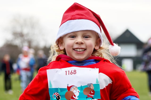 Woody (4).  The Myton Hospice’s famous Santa Dash at Victoria Park, Leamington Spa, Warwickshire, a 5K festive charity fun run with around 1300 Santa's. December 10, 2023.  See SWNS story SWNAsanta.