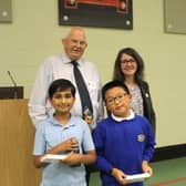 The winning team from Cawston Grange Primary School (front row left to right) Adhruth Parlattaya and Yuhan Wang with Douglas Buchanan from DCBEAGLE Challenges and Head of Maths at Princethorpand Head of Maths at Princethorpe College, Sharon McBride (back row left to right).
