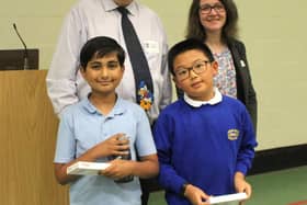 The winning team from Cawston Grange Primary School (front row left to right) Adhruth Parlattaya and Yuhan Wang with Douglas Buchanan from DCBEAGLE Challenges and Head of Maths at Princethorpand Head of Maths at Princethorpe College, Sharon McBride (back row left to right).