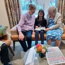 Year 6 student reads to residents