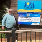 Chris & Tony Luckett presenting the cheque to Zoe's Place