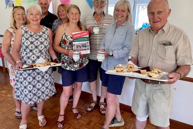 Front left: Lucy Jones with the team of volunteers from Baginton Village Hall and cakes at the ready at their summer Warm Hub launch event. Photo supplied