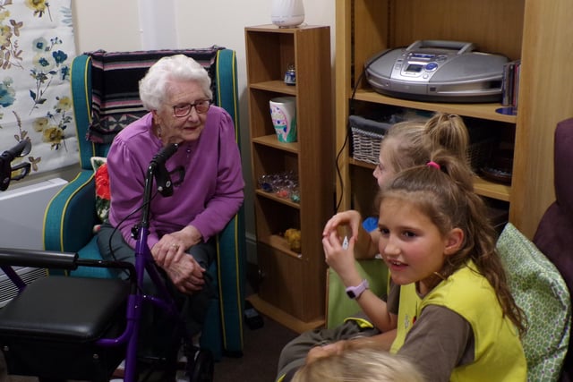 The Brownies heard about the residents' time in the British Armed Forces and their memories of Brownies and Guides. Photo supplied