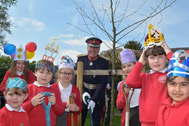 Tim Cox Lord Lieutenant of Warwickshire, with some of the children at the tree planting. Photo by Mark Griffin