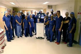 Surgical teams at UHCW NHS Trust with the revolutionary AURA 10 imaging device