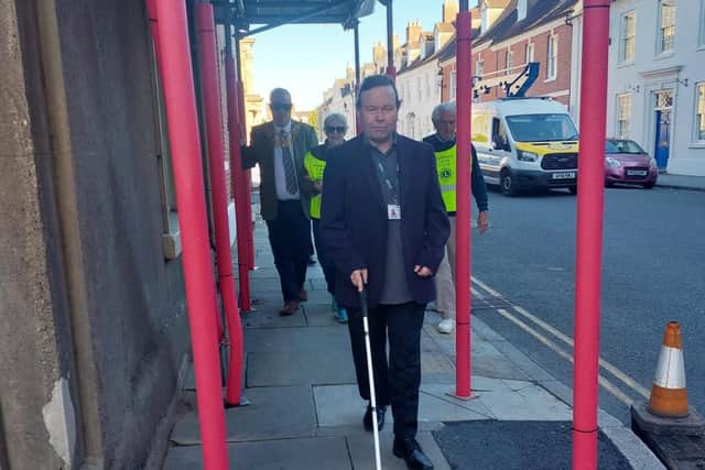 The Mayor of Warwick, Cllr Simon Pargeter navigating the town with representatives from the Warwick Lions and Warwickshire Vision Support wearing visual impairing glasses. Photo by the Mayor of Warwick