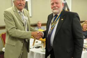 Outgoing Rotary President Alan Bailey welcomes Dick Dixon