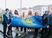 Pictured raising the Commonwealth Flag from left to right: Councillor Parminder Singh Birdi, Mayor of Warwick; Christina Boxer, WDC Commonwealth Games Programme Manager; Councillor Mini Kaur Mangat, Chair of Warwick District Council; Mrs Pat Edgington, Royal British Legion Chairman; Lauren Cox, Commonwealth Games Swimming Relay Bronze Medallist; Councillor Sidney Syson, Vice-Chairman of Warwick District Council; Councillor Nick Wilkins, Mayor of Royal Leamington Spa; Councillor Barry Franklin, Mayor of Whitnash.