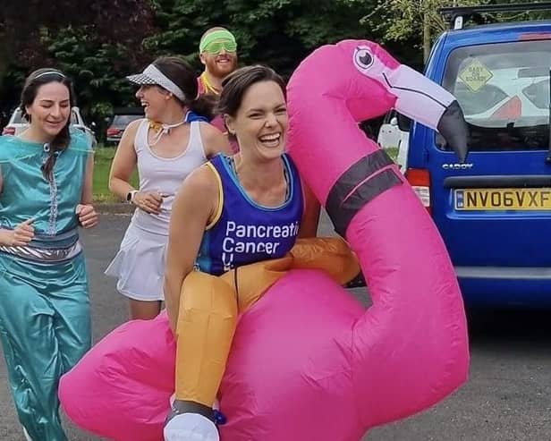 Sophie Knee-Higgins and her team of runners ran through Kineton dressed as an inflatable flamingo, Forest Gump, Princess Jasmine and Mr Motivator.