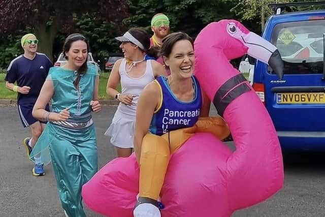 Sophie Knee-Higgins and her team of runners ran through Kineton dressed as an inflatable flamingo, Forest Gump, Princess Jasmine and Mr Motivator.
