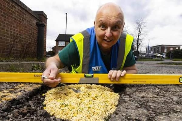 Mark Morrell, aka Mr Pothole, fixes a pothole with Pot Noodle as the first step in his new potty campaign