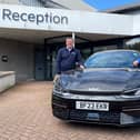 Richard Roberts (left), dealership principal at Startin Kia – Warwick, and Barry Andrews, chairman of Leamington Rotary Club’s fundraising committee, with a Kia EV electric car.