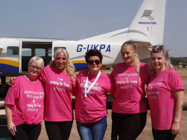 Tracie Mills (centre) with the four skydivers.