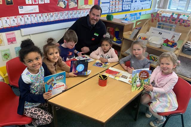 Stuart King, store manager of The Co-operative in Lawford Road, New Bilton, with pupils at St Matthew’s Bloxam C of E Primary School.