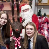 Sophie Green and Ravin Williams enjoy seeing Santa Claus.