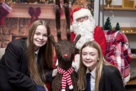 Sophie Green and Ravin Williams enjoy seeing Santa Claus.