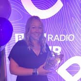 Naomi with her award.