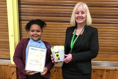 Ebony Pierce from Whitnash Primary receiving her award