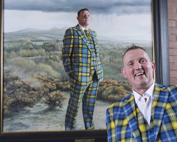 Doddie Weir with his painting in the Scottish National Portrait Gallery (SNPG)