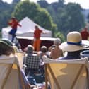 View from behind two visitors seated in deckchairs as part of the audience at the Illyria Theatre Company's production of Ali Baba & the Forty Thieves at Dudmaston. M.R.