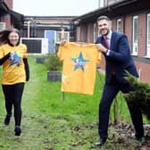 The Wigley Group&#39;s Laura Liggins - who is running for SWFT Charity - alongside South Warwickshire University NHS Foundation Trust MD Adam Carson at the site of the
planned sensory garden at Warwick Hospital. Photo supplied