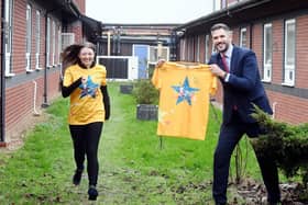 The Wigley Group&#39;s Laura Liggins - who is running for SWFT Charity - alongside South Warwickshire University NHS Foundation Trust MD Adam Carson at the site of the
planned sensory garden at Warwick Hospital. Photo supplied