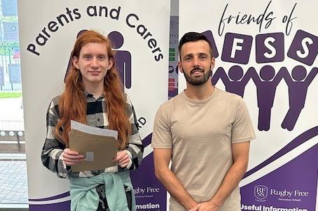 Head of Sixth Form at Rugby Free School Mitch Chadwick (right) with one of the student who received their results. Photo supplied by Rugby Free School