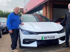 Barry Andrews (left), chairman of Leamington Rotary Club’s fundraising committee, with Warwick Kia managing director David Derbyshire beside a Kia Electric
