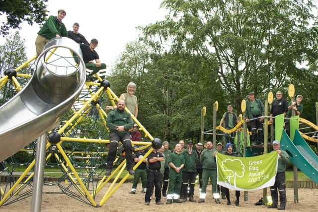 Flying the flag - Rugby Borough Council's grounds team celebrate the Green Flag success in Caldecott Park.