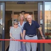New residents Alison Partridge and John Ackerman, cutting the ribbon to open the new care home. Stood behind them is Phillippa Cook, general manager of the home. Photo supplied