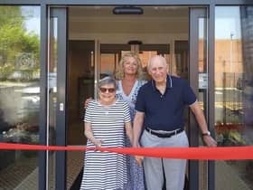 New residents Alison Partridge and John Ackerman, cutting the ribbon to open the new care home. Stood behind them is Phillippa Cook, general manager of the home. Photo supplied