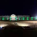 The Dallas Burston Polo Club in Southam lit up in green in support of the NSPCC and Childline's Walk for Children fundraising event.