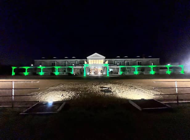 The Dallas Burston Polo Club in Southam lit up in green in support of the NSPCC and Childline's Walk for Children fundraising event.