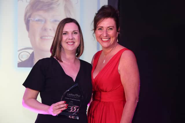 Sue Ford of Action Coach receives her Achieves Through Networking Award from Sharon Louca of The Women In Business Network. Photo by Dy Holme of Spaces and Faces Photography