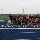 Members of Rugby & Northampton AC pose for the camera after their super effort in Manchester