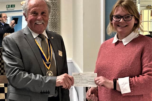 Photo shows President Brian Bassett presenting Leamington Rotary club's  cheque to Jo Merrick, Operations Manager of Helping Hands Community Project.