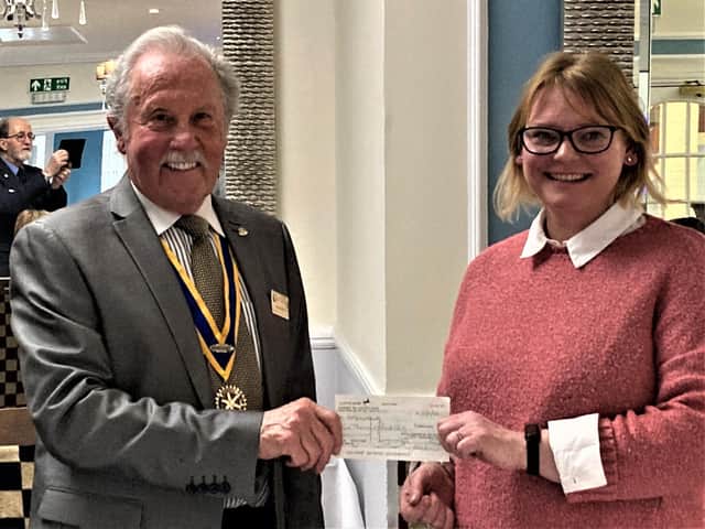 Photo shows President Brian Bassett presenting Leamington Rotary club's  cheque to Jo Merrick, Operations Manager of Helping Hands Community Project.