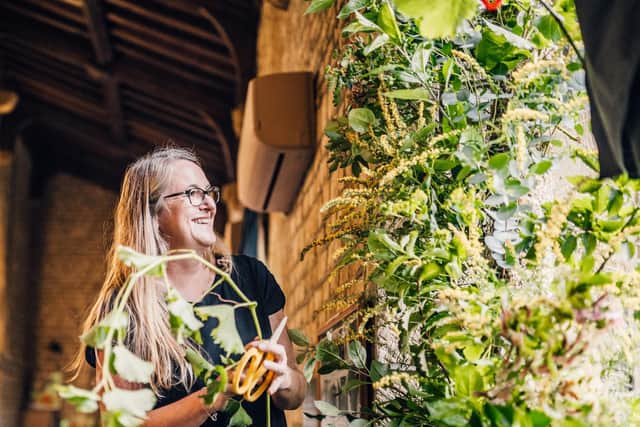 Nicola Hill of Gentle Blooms creating a floral installation. Credit: Alice Morgan Photography