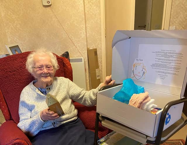 Dorothy Mitchell, 103 years old, pictured with her care box.