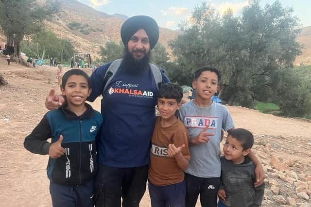 Bill Mato with young survivors of the earthquake in Morocco. Picture supplied.
