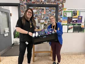 Alex Pearson donating £50 worth of sanitary products to Katrina from Young Peoples First. Photo supplied