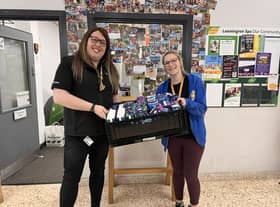 Alex Pearson donating £50 worth of sanitary products to Katrina from Young Peoples First. Photo supplied