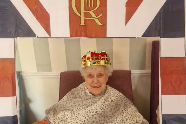 Smiling resident enjoys the celebrations.