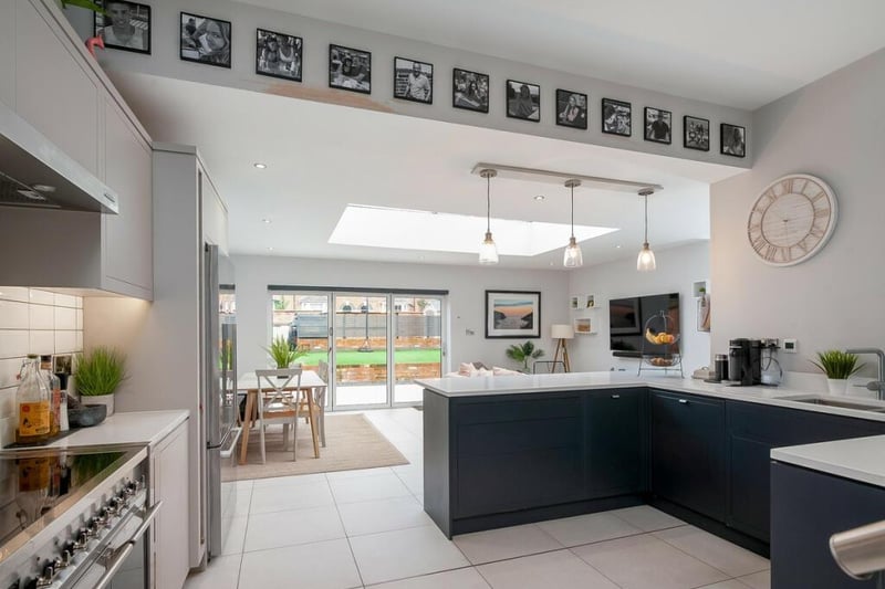 The open plan kitchen/dining/living area. Photo by Fine and Country