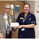Warwick Probus Club No. 2 Chairman Brian Perkins presenting Mary Ward manager Sara Houghton with a cheque. Photo supplied